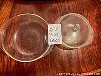 Top view showing both glass bowls and the lid, clear and round shape.