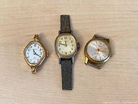 Front view of three vintage ladies watch faces: Cardinal, Timex with strap, and Clebar Swiss 21 Jewels without strap.