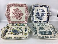 All four Mason's china plates arranged in two rows, showing variety of floral and scenic patterns, colors red, blue, and multicolor, square shape with handles