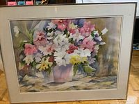 Framed watercolor painting of a colorful floral bouquet in a purple vase against a muted background.