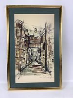 Framed watercolor painting showing full artwork with green matte and gold frame.