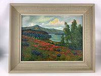 Full frontal view of the original landscape painting in textured beige frame showing lake, mountains, flowers and trees.