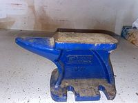 Side view of Record No 11 anvil painted blue with the brand and model embossed on the side.