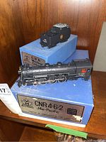 Locomotive and caboose on original blue Samhongsa boxes