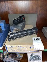 Full view of locomotive and two original boxes (locomotive box labeled CNR 4-8-4, caboose box labeled CNR Caboose)