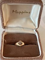 Ring presented in a Mappins jewelry box showing top lid and ring placement