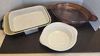 Full view of the ceramic and Pyrex bakeware set displayed, showing all four items together