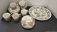 7 Ridgeway China 'Country Days' side plates stacked, 6 cups, 6 saucers, and 1 Wood & Sons 'Dorset' serving plate