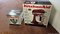 Mixer in original box alongside boxed extra bowl