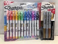 Photo showing a 10-pack of Sharpie Shorts markers in assorted colors and a 3-pack of metallic Sharpie markers in gold, silver, and bronze, both new in packages.