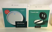 Two boxes side by side: Dodow sleep machine and Dodow travel case