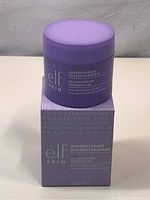 Photo of purple jar of Elf Skin Superhydrate Gel Moisturizer atop its matching box, showing front label with product name and details.