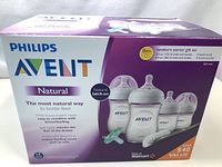 Closed boxed packaging showing Philips Avent Natural newborn starter gift set with 4 bottles, nipple brush missing as per seller note.