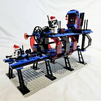 Assembled set on baseplate with one minifigure positioned on walkway and another on platform
