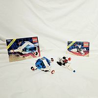 Photo of both assembled LEGO sets 6850 and 6810 with their original instruction booklets.