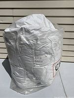 Duvet folded and packaged in clear plastic bag