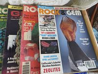 Partial front cover view of several vintage Rock & Gem and Jewelry Craft magazines showing titles and some cover images of gemstones and lapidary projects