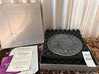 Full view of the collectible plate in protective foam inside original box with certificate of authenticity and packaging.