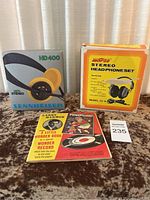 Sennheiser HD400 headphones in original box alongside Morse stereo headphone set box and two children's vinyl records.