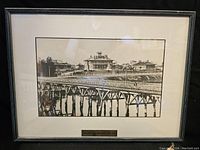 Full front view of framed photograph showing frame, mat and image