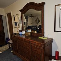 Full view of the dresser with attached mirror showing the style and condition.