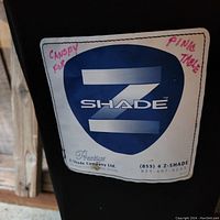 Close-up of the canopy carrying case label with brand name Z-Shade and usage note for picnic table canopy.
