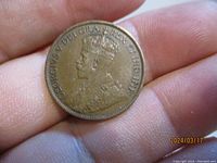 Obverse side of the 1912 Canadian one cent coin showing the crowned profile of King George V with surrounding text.