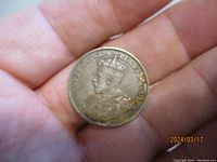 Obverse side of the 1914 Canadian one cent coin showing King George V with inscriptions.