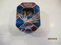 Metal Pokemon Trading Card Game tin with Xerneas artwork from the front and top.