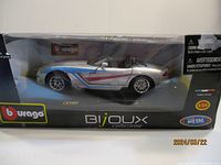 Burago die cast Viper model car in original box, showing side profile of silver convertible with blue and red striping.