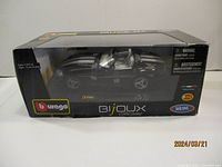 Front view of boxed Burago Dodge Viper 1:24 die cast model car.