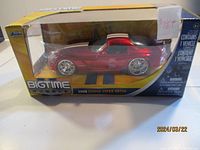 Front view of the diecast 2008 Dodge Viper SRT10 model inside original Jada Bigtime Muscle box, showing metallic red paint with white racing stripes and wheels.