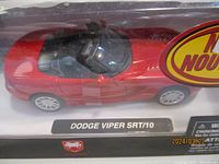 Top angled view of red Dodge Viper SRT/10 die-cast model showing details and clear display packaging.