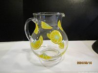 Clear glass jug showing full front with yellow lemon slice decals.