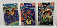 Front view of the three Superman Annual comic books #1-3 in protective sleeves showing cover art and condition.