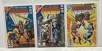 Photo showing all three Masters of the Universe comic issues #1, #2, #3 in clear protective bags with covers visible, showing colorful action poses.