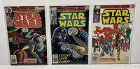 Three Marvel Star Wars comics #22, #23, #47 front covers shown in protective bags.