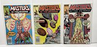 Three comic books Masters of the Universe #1-3 displayed side by side in protective bags.