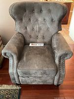 Full front view of gray wingback recliner showing overall appearance