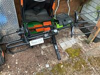 Overview of full rack assembly on ground showing shank, main frame, wheel trays, and support arms.