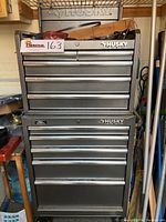 Front view of stacked tool chests showing brand labels and general setup