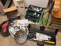 Overall view of all items including clock, tackle box, knee kicker, laser level case, and others.