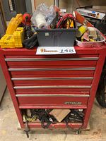 Front view of red Waterloo rolling metal tool chest with top bin and bottom shelf loaded