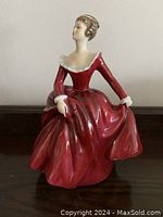 Front view of the Royal Doulton HN3311 figurine 'Fragrance' in red dress.