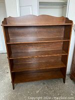 Front view of bookcase showing overall design and condition