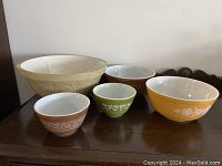 Front view of the 5 mixing bowls set, showing colorful Pyrex bowls and the large beige TG Green Gripstand bowl.