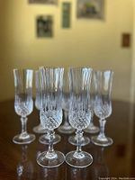 Front view showing details and pattern on 5 glasses arranged in a row.
