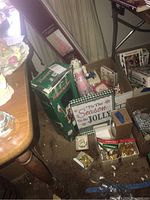 General overview of vintage holiday decorations including assorted boxes, pink tree box, nutcracker box, and holiday decor.