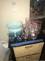 Full view of all glasses and Pyrex bowls on black surface
