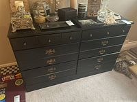 Front and angled views of the black wooden dresser showing six drawers with metal pulls
